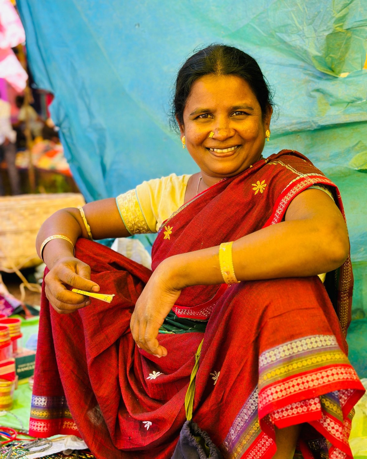 A woman entrepreneur at a local market stall, representative of the everyday merchants Abheepay is built to serve